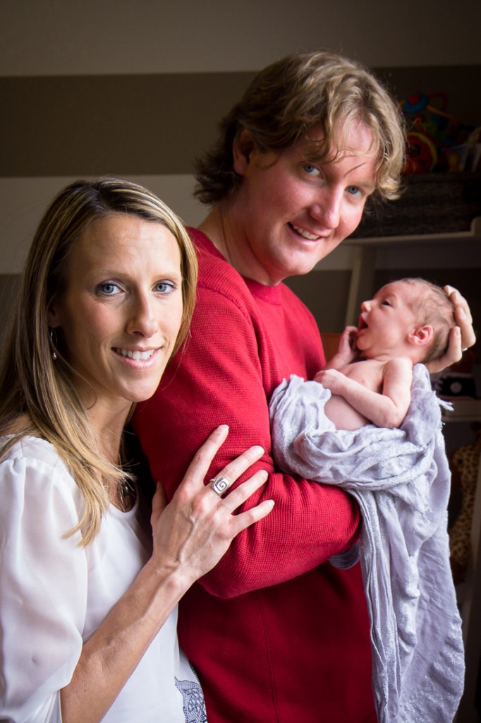 Family portrait with a newborn baby girl