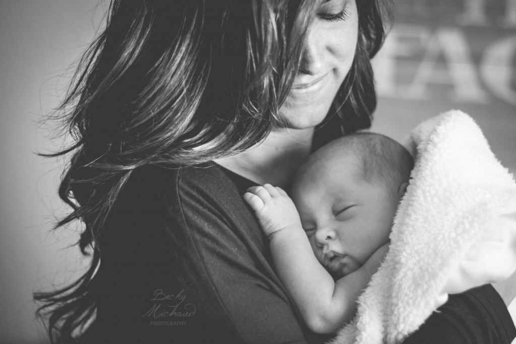 Black and white portrait of a mom with her baby girl