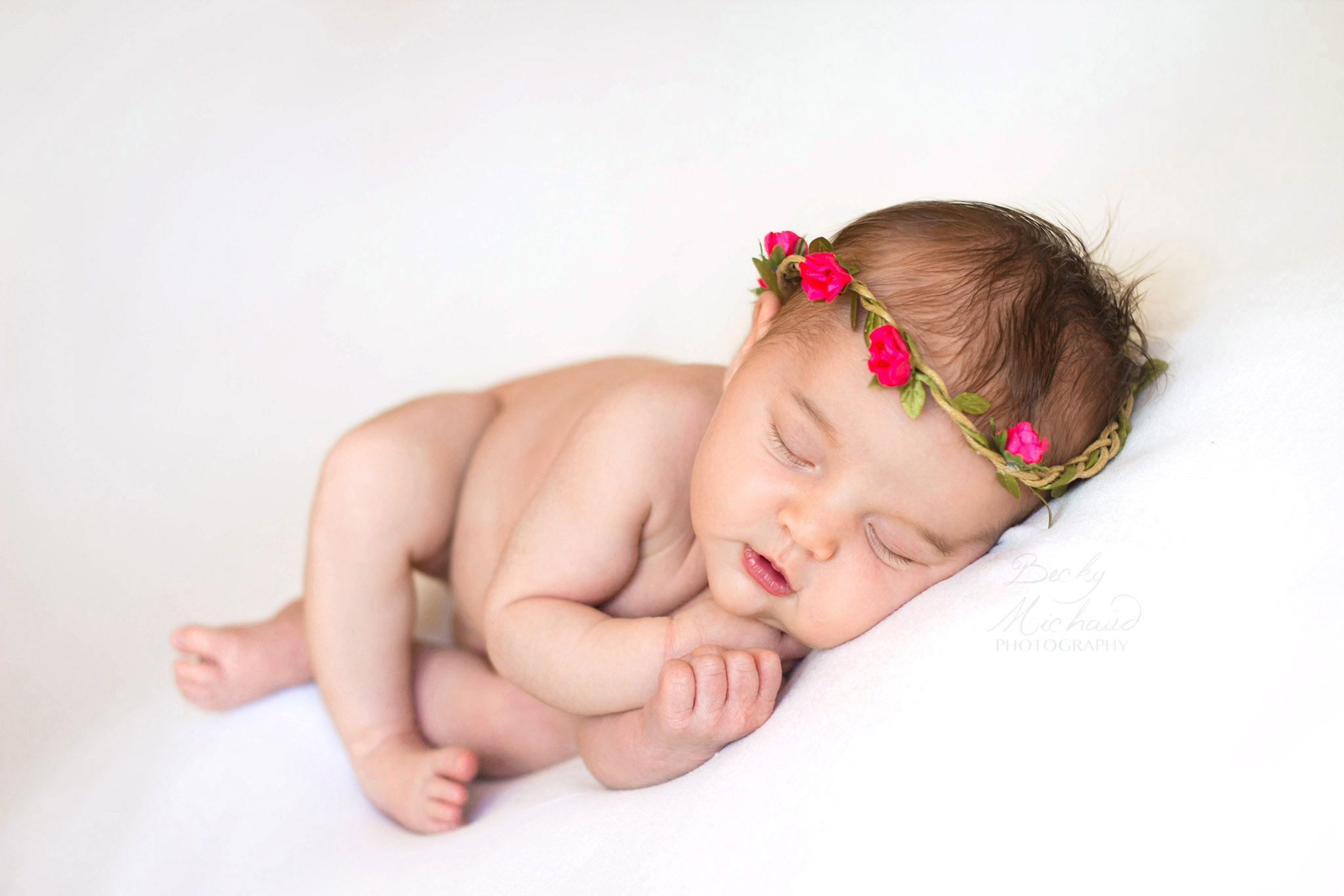 newborn baby girl with pink flower crown