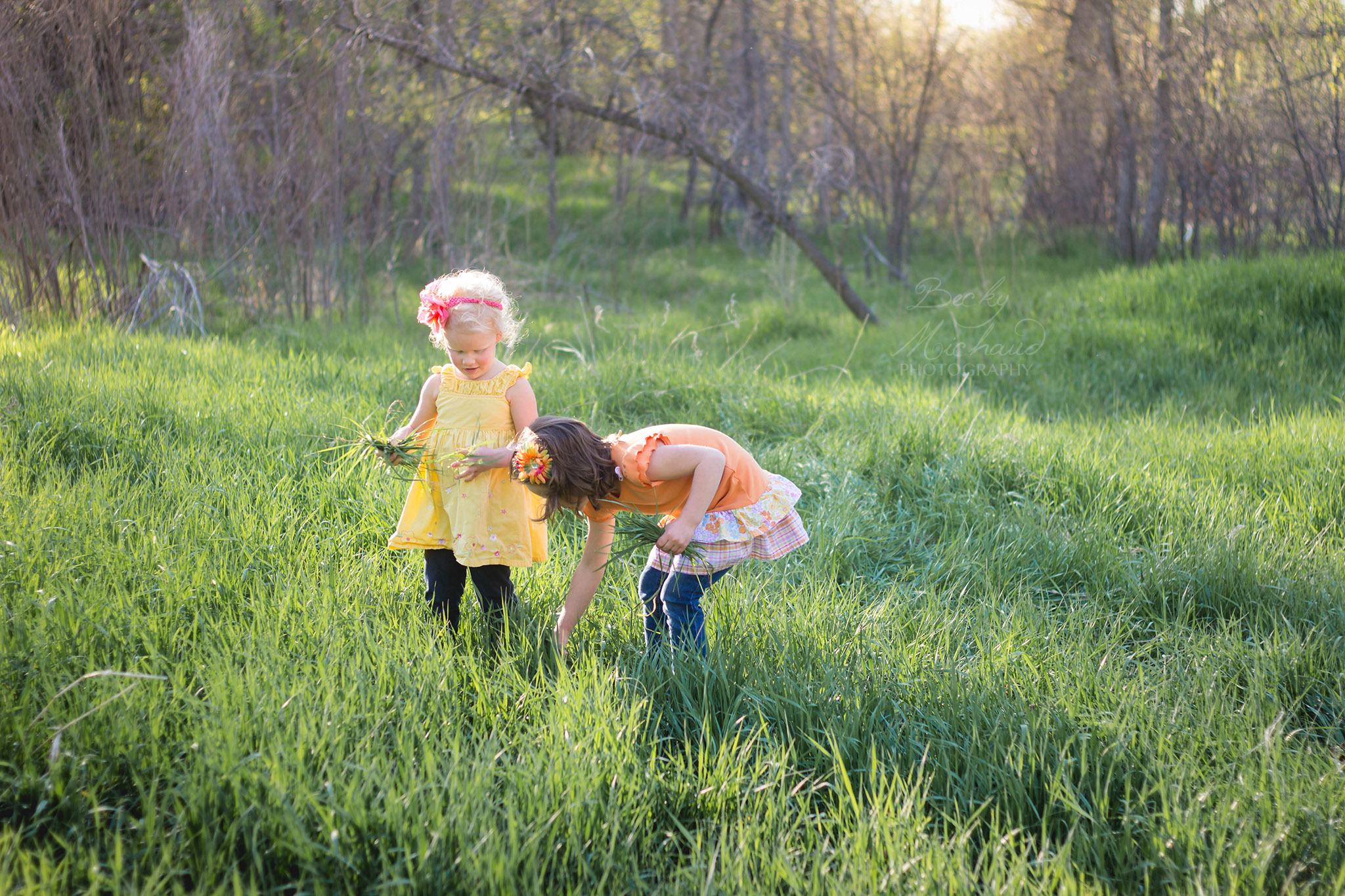 girls picking flowers at McMurry Natural Area in Fort Collins