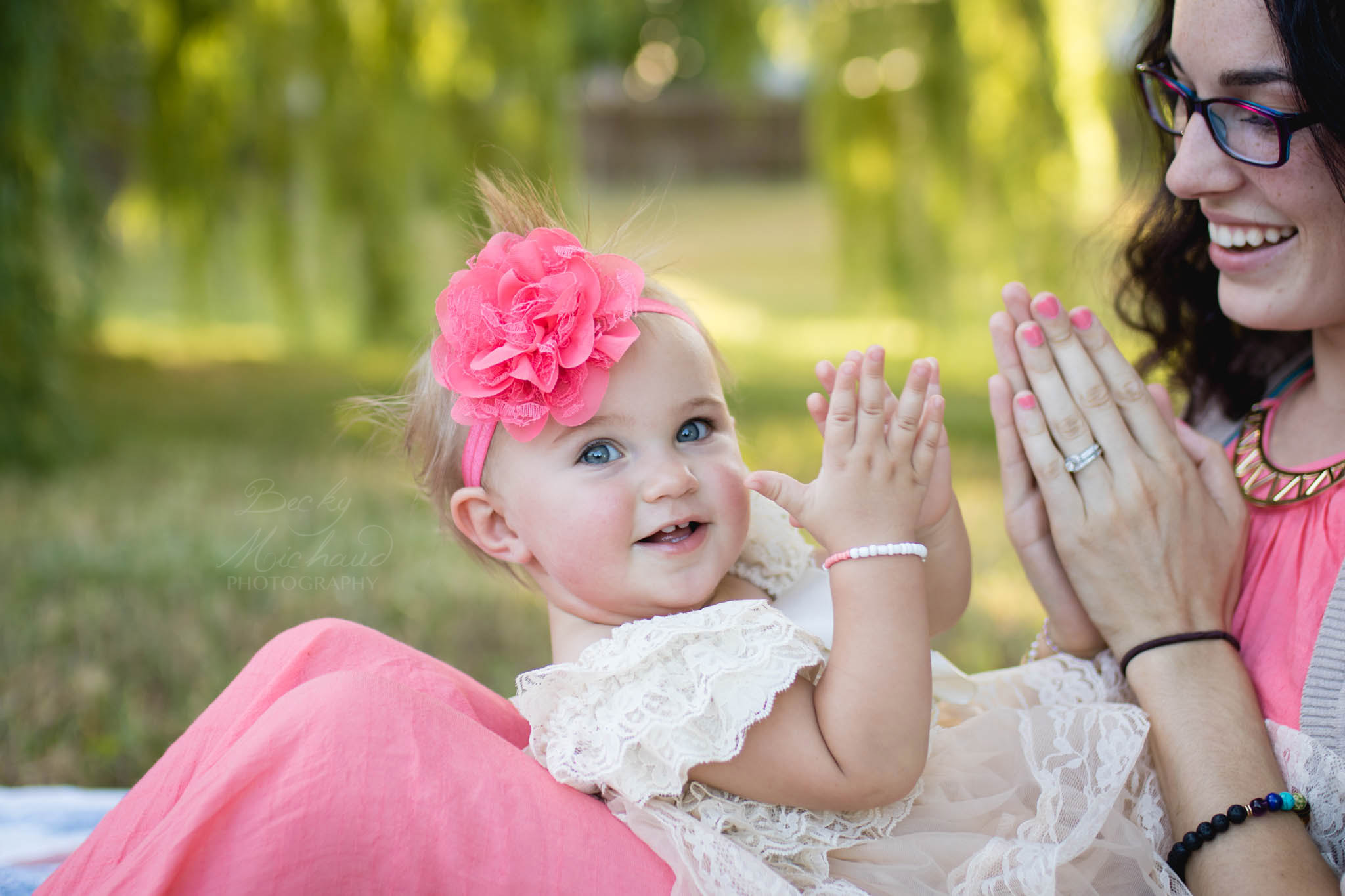 Mom and daughter clapping together