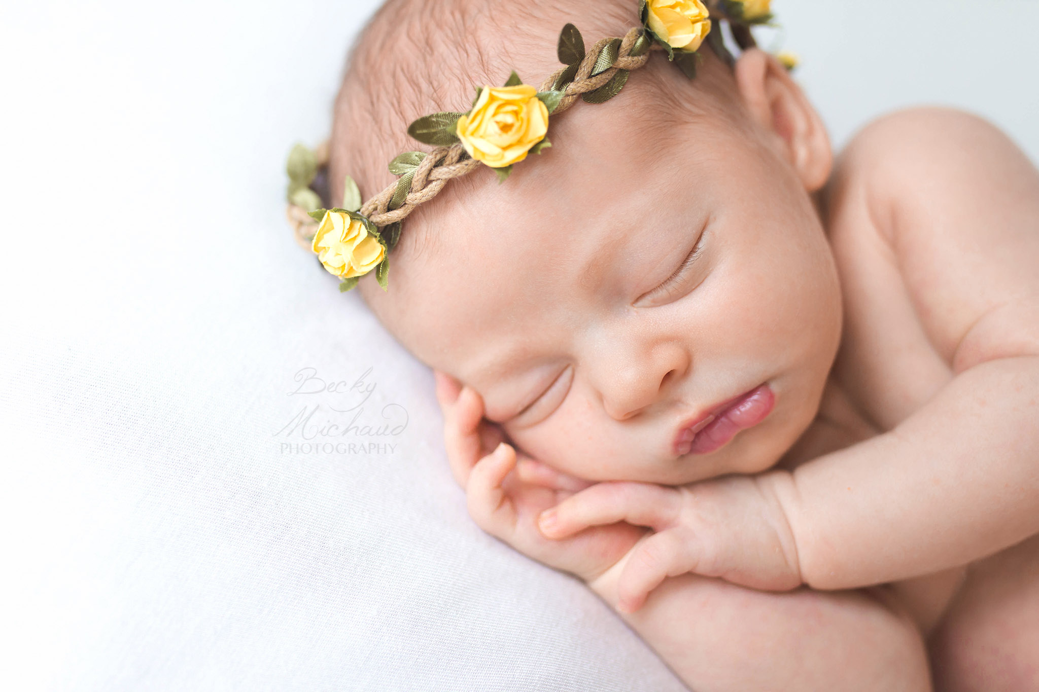 Newborn photography in Fort Collins, baby wearing yellow floral crown