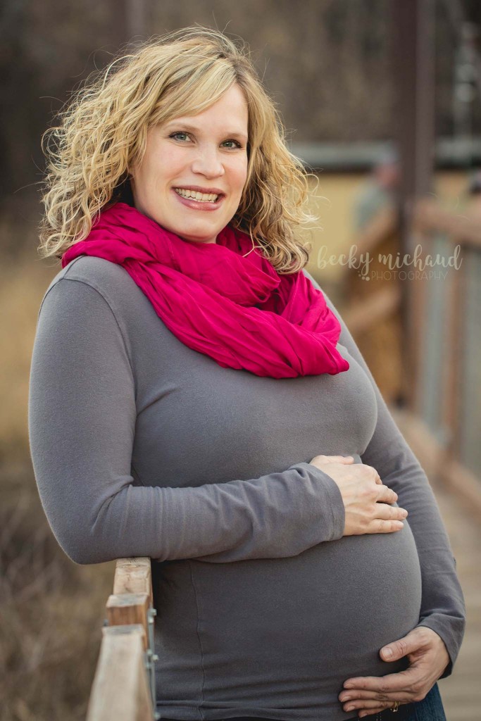 Maternity photo of an expectant mom on a bridge