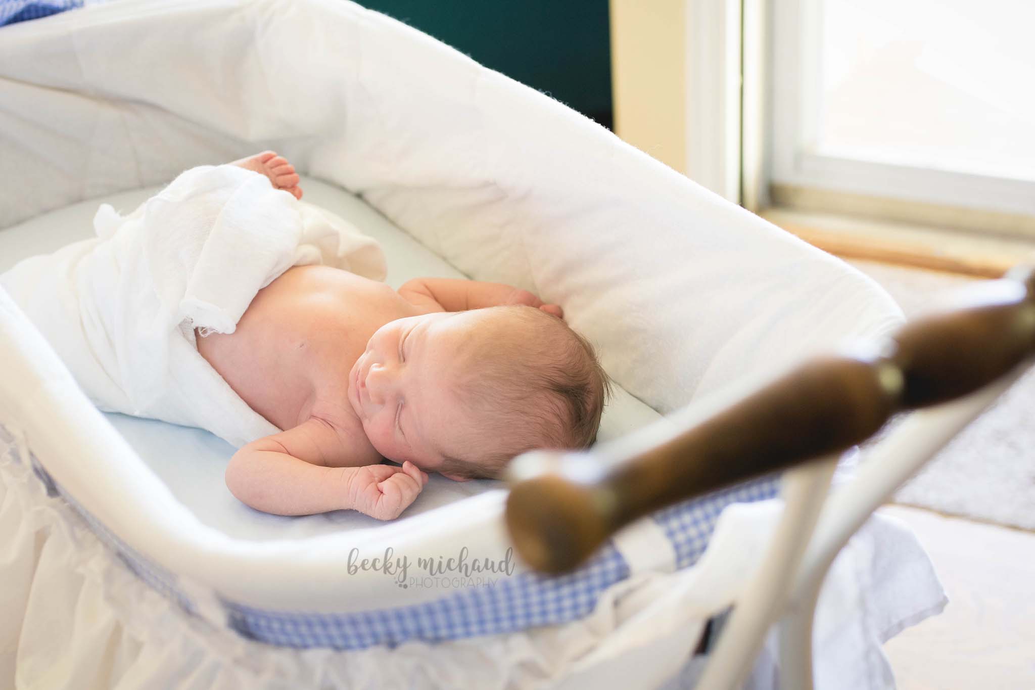 newborn baby in a family heirloom baby carriage