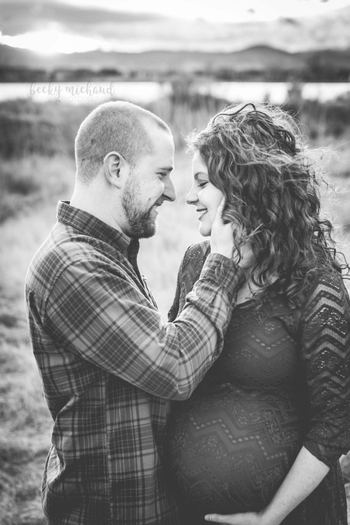 black and white portrait of a couple awaiting a new baby
