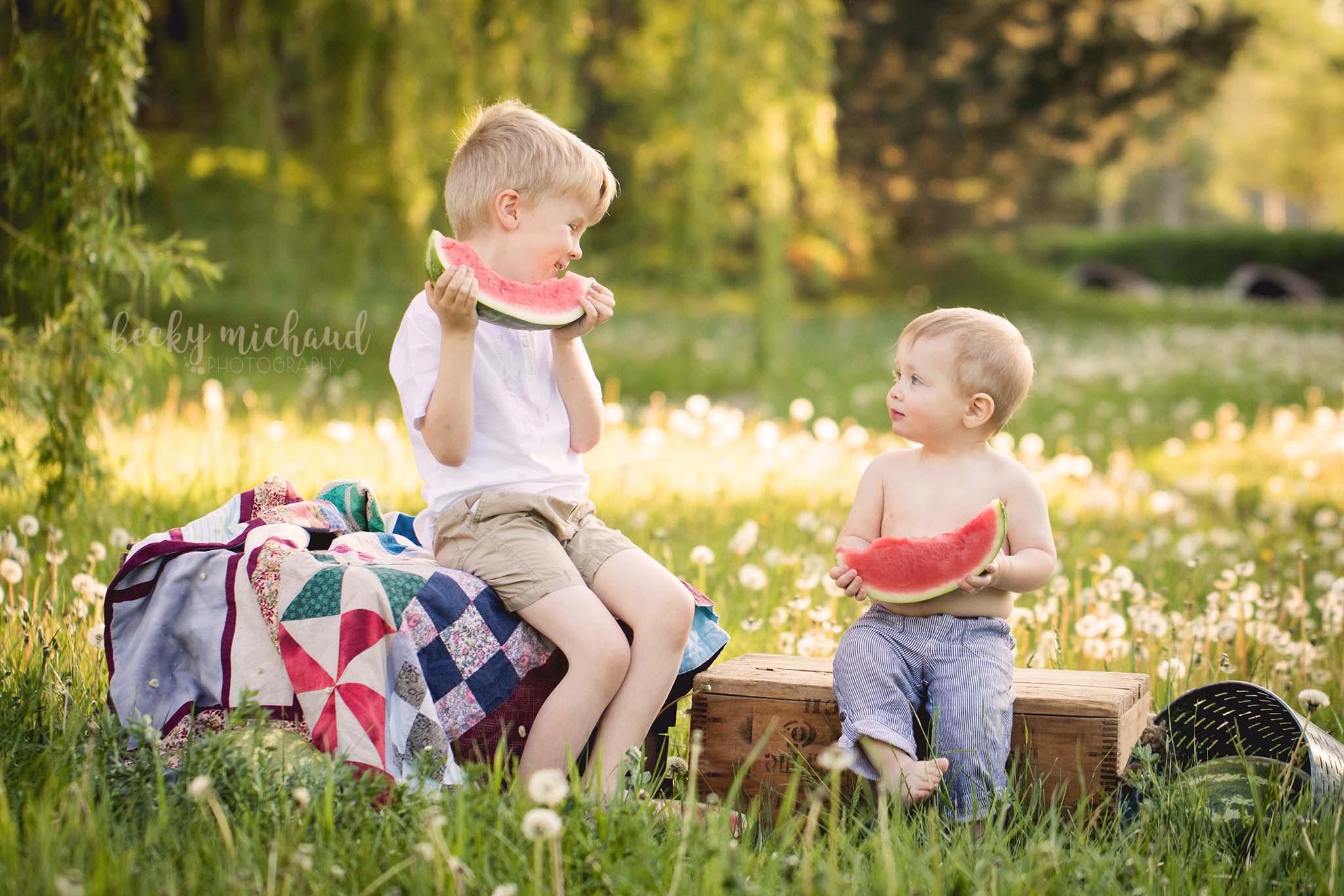 Two brothers enjoying a snack together under the willow trees in Fort Collins