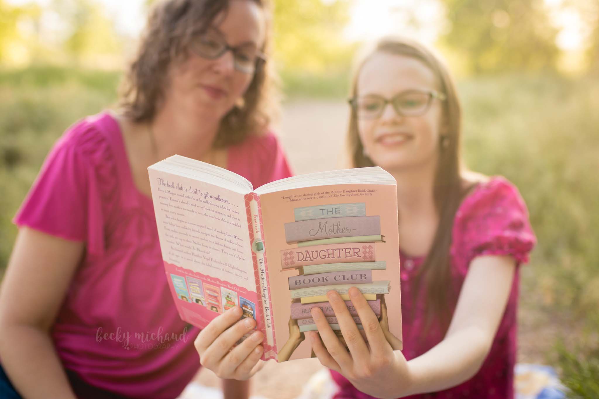 a mom and daughter reading the Mother Daughter Book Club together