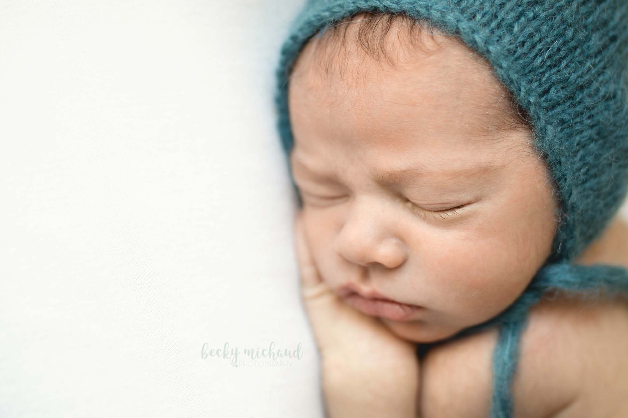 close of of a sleeping newborn taken by Becky Michaud, on of Fort Collins best newborn photographers