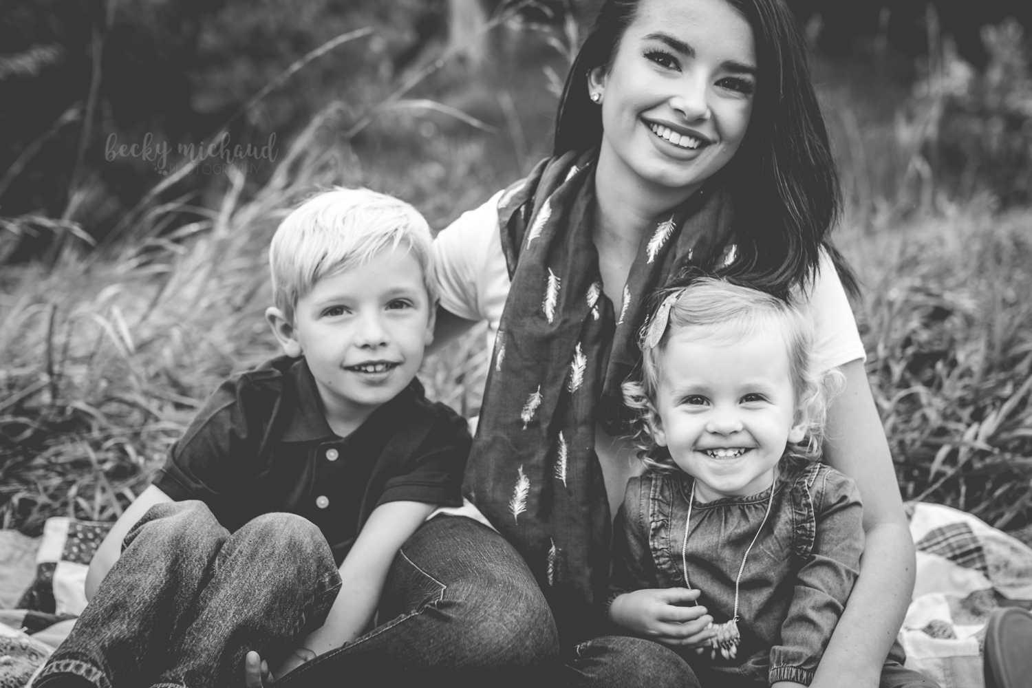 black and white portrait of three siblings in Loveland, Colorado taken by family photographer Becky Michaud