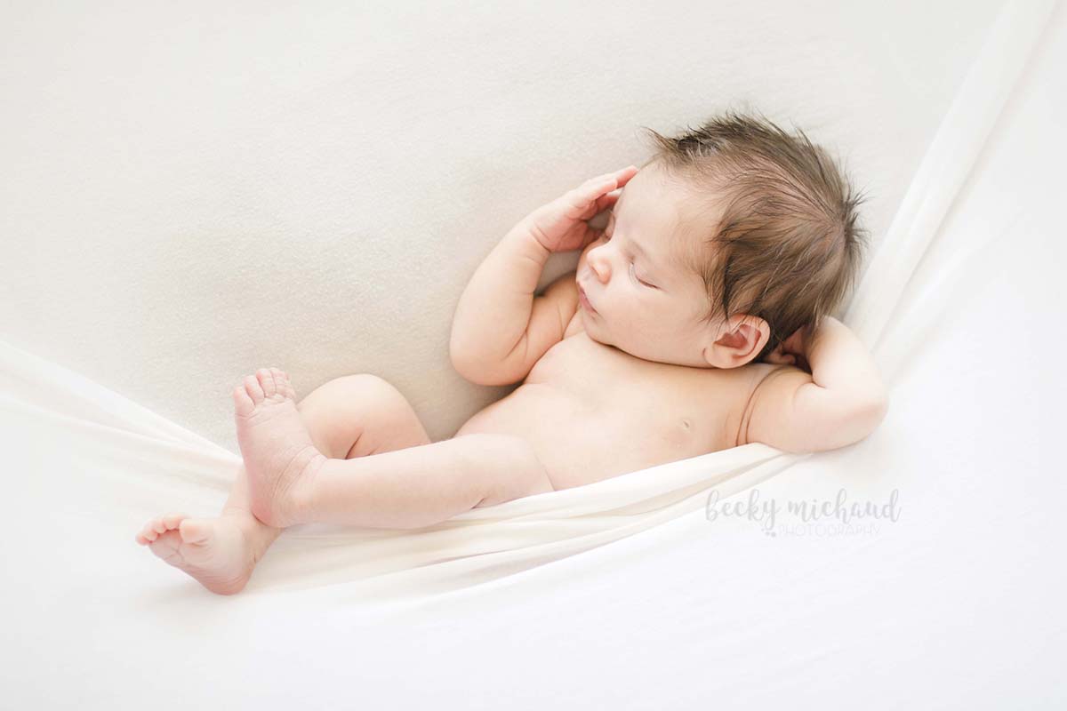 Simple newborn photo using baby in a pocket pose