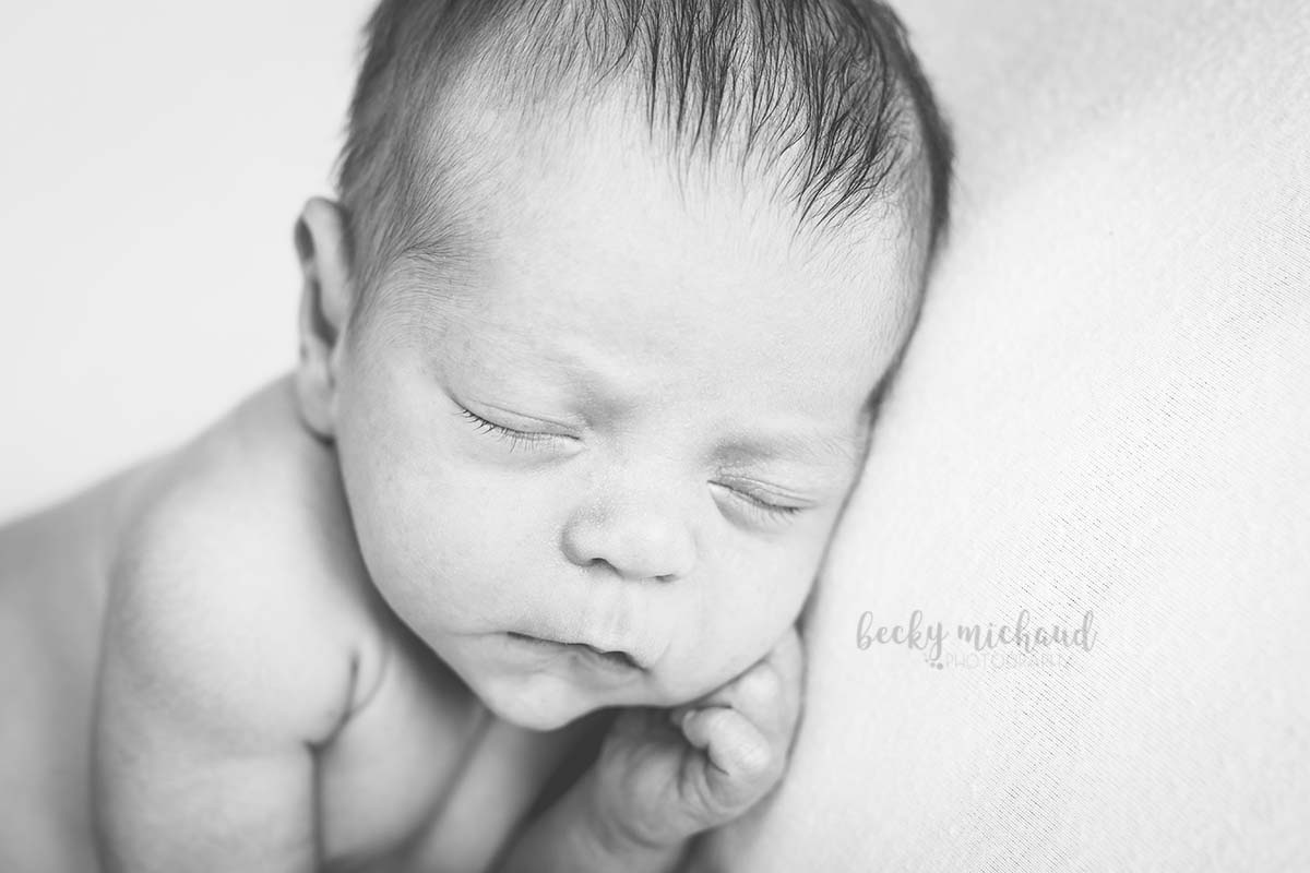 black and white close up of a newborn baby
