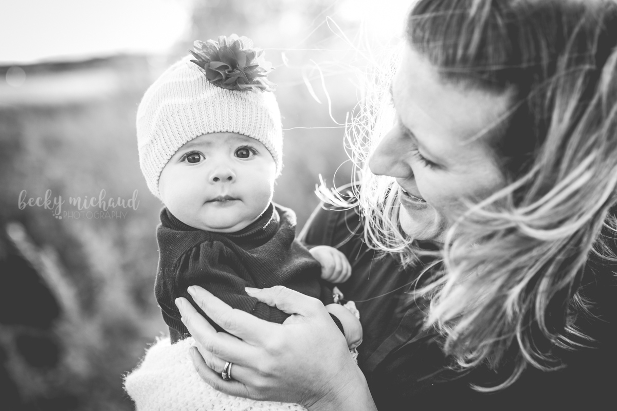 Black and white portrait of mom with her baby girl