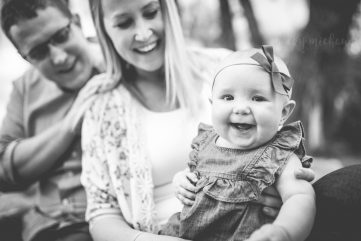 Monochrome photo of a baby girl with her parents