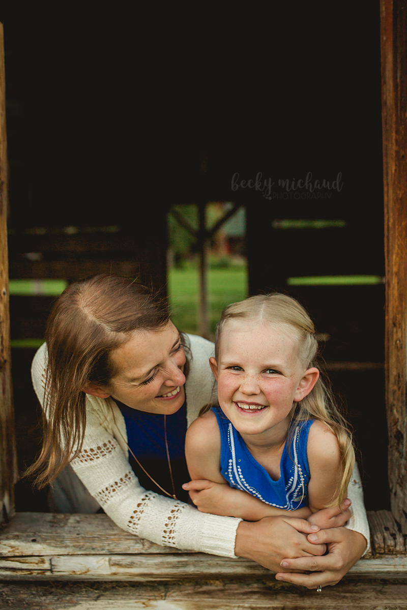 A mom looks at her daughter during their Colorado family photo session