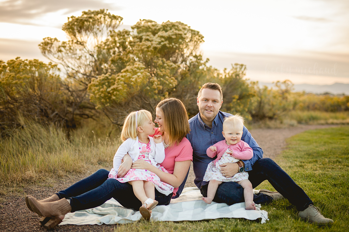 Family portrait of a family dressed in pink and blue in Loveland, Colorado