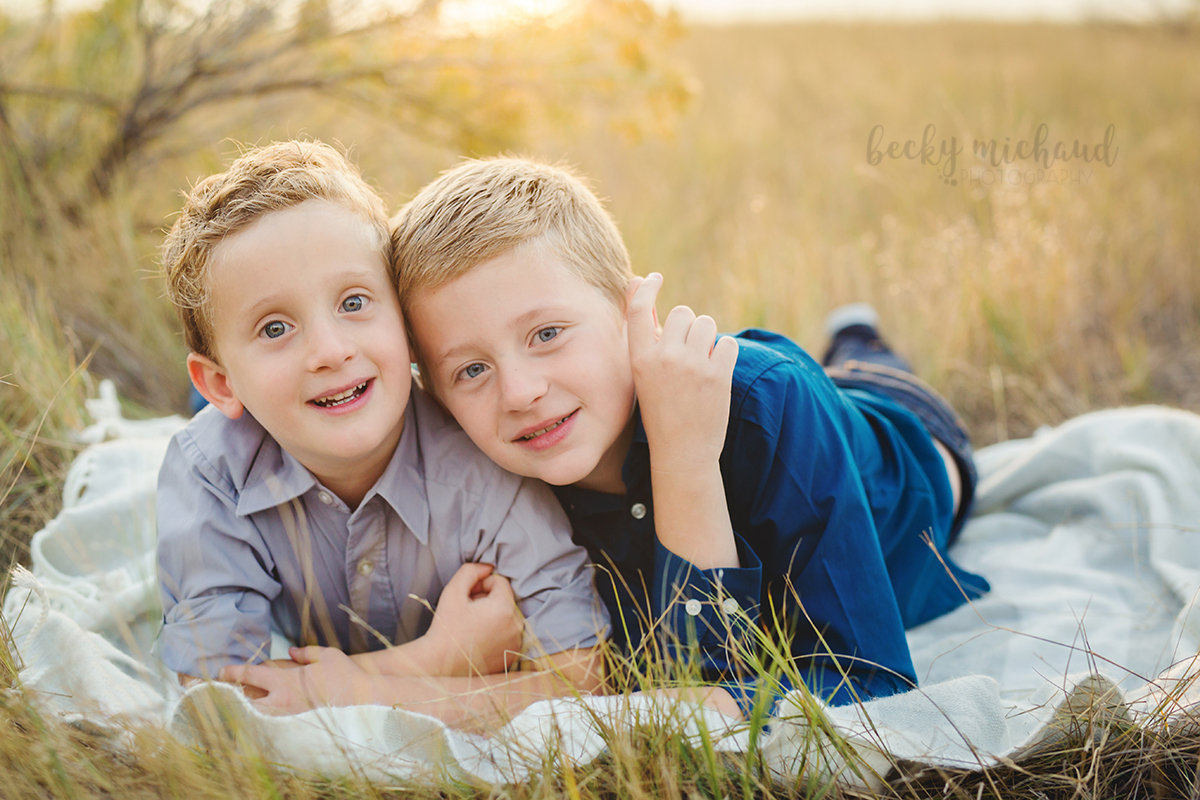 Two brothers share a quiet moment during their Loveland family photo session