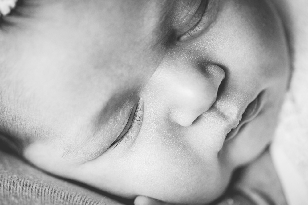 Black and white macro photo of a newborn baby girl, taken by Becky Michaud, Colorado newborn photographer