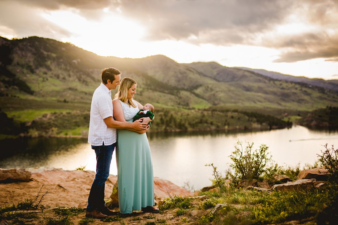 New parents hold their baby at Horsetooth Reservoir in Fort Collins, Colorado