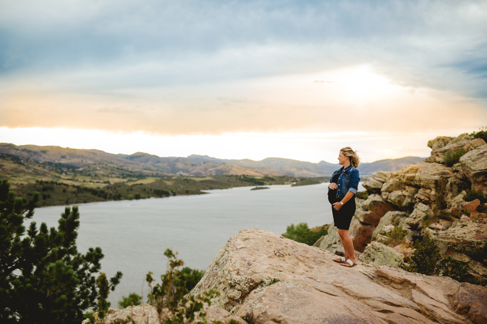An expectant mom looks out over Horsetooth Reservoir in photo taken by Becky Michaud, Fort Collins photographer