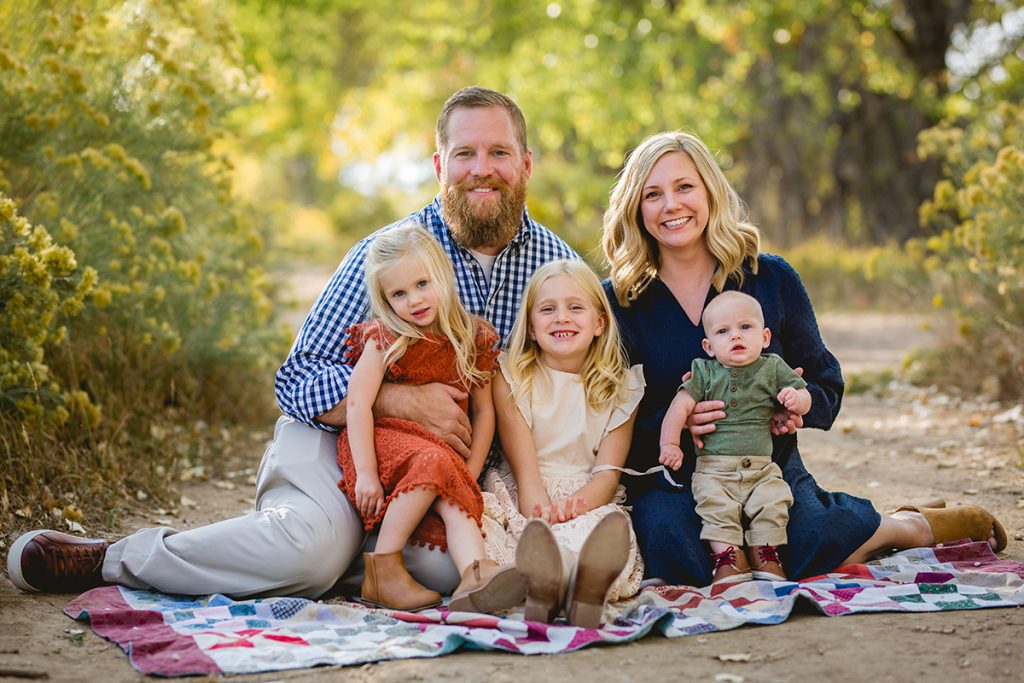 A family of five poses for a photo taken by Fort Collins photographer Becky Michaud
