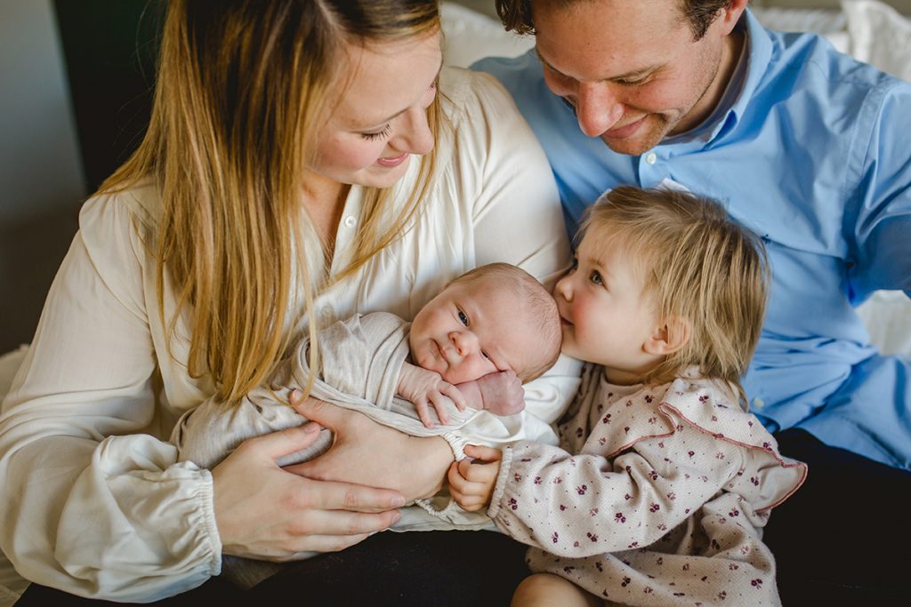 intimate photo of a family of four with their newborn baby taken by Becky Michaud, Fort Collins Photographer