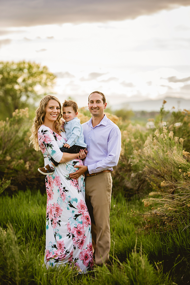 A family of three poses for their maternity photos taken by Becky Michaud, Fort Collins photographer