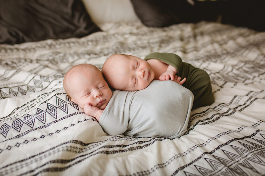 Lifestyle newborn photo in Fort Collins Colorado home of twin babies on bed
