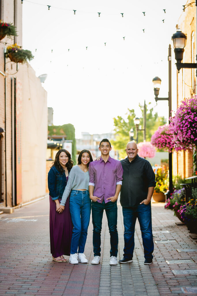 Old Town Fort Collins family photo session with flower baskets in summertime